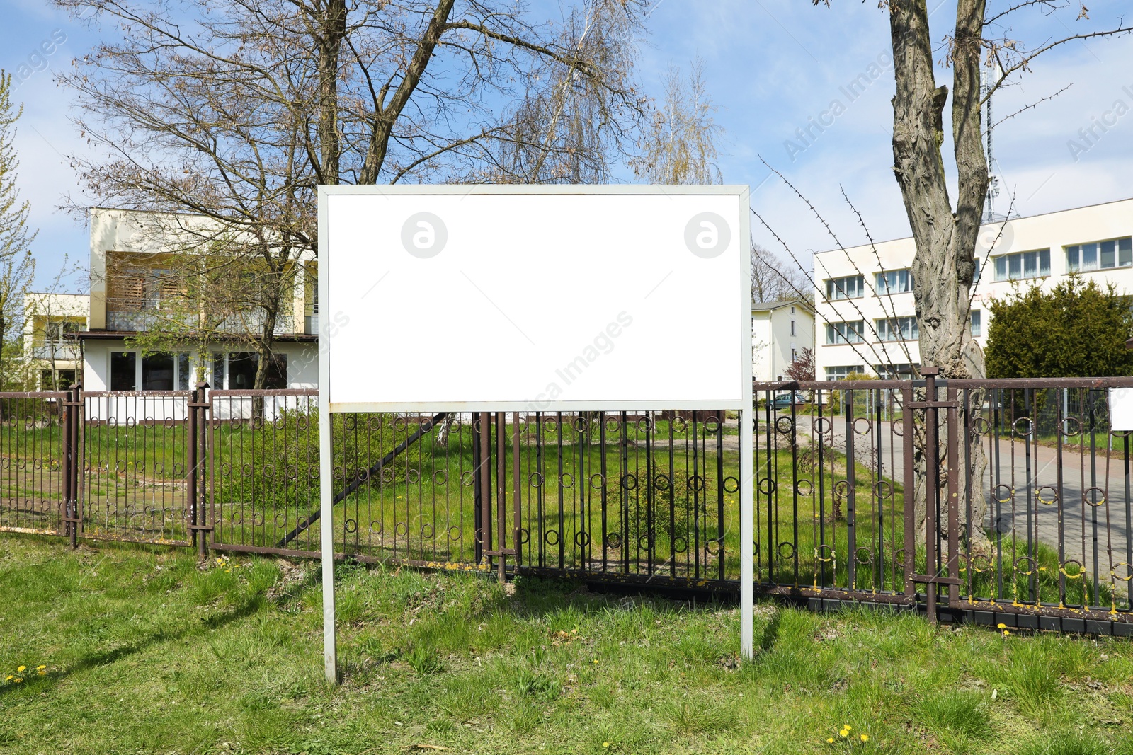 Image of Empty signboard outdoors on sunny day. Mock-up for design