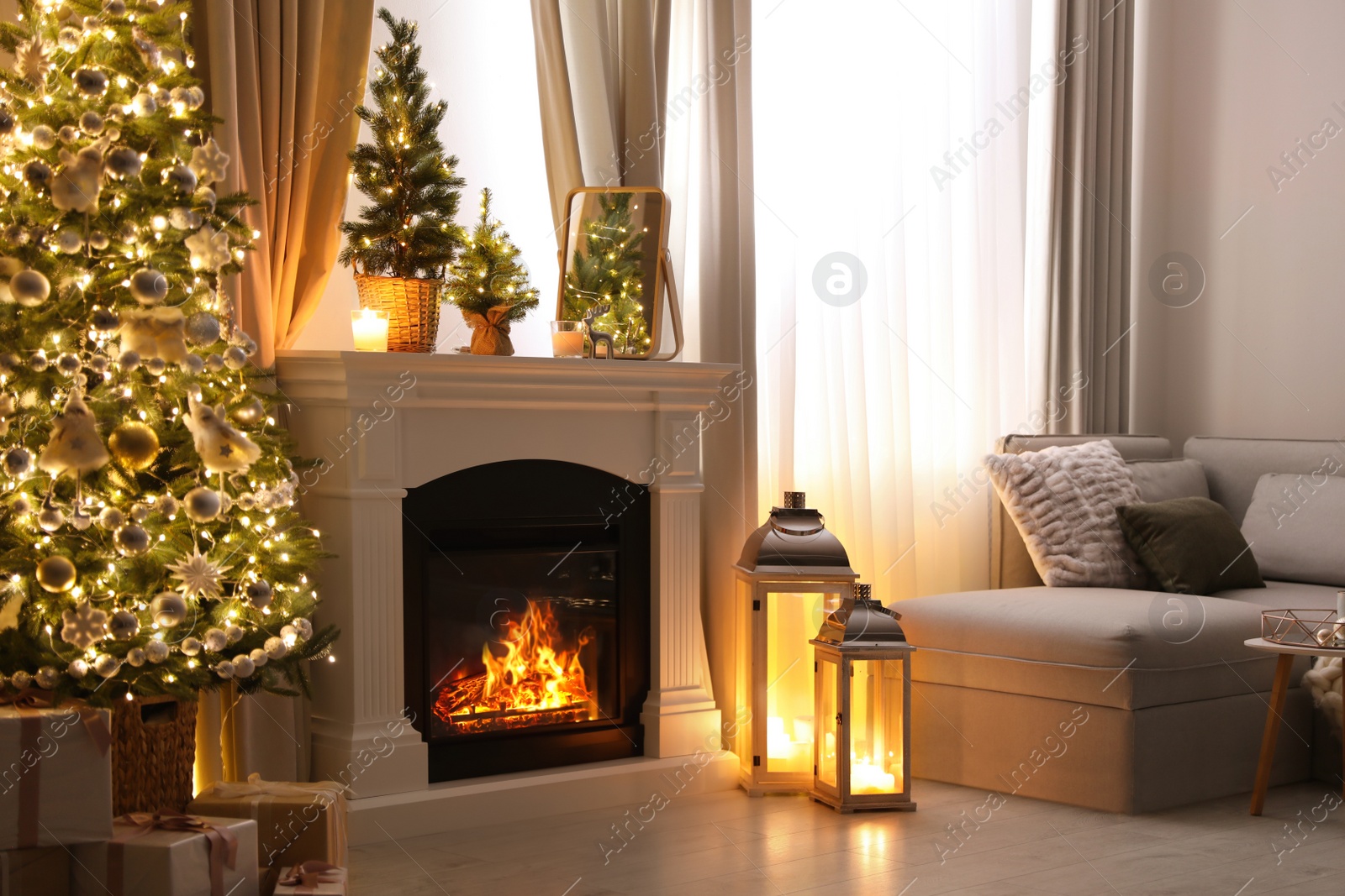 Photo of Stylish living room interior with beautiful fireplace, Christmas tree and other decorations