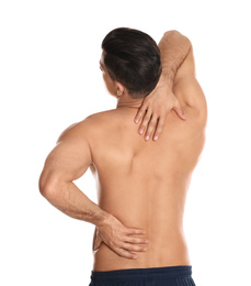 Photo of Man suffering from pain in back on white background. Visiting orthopedist