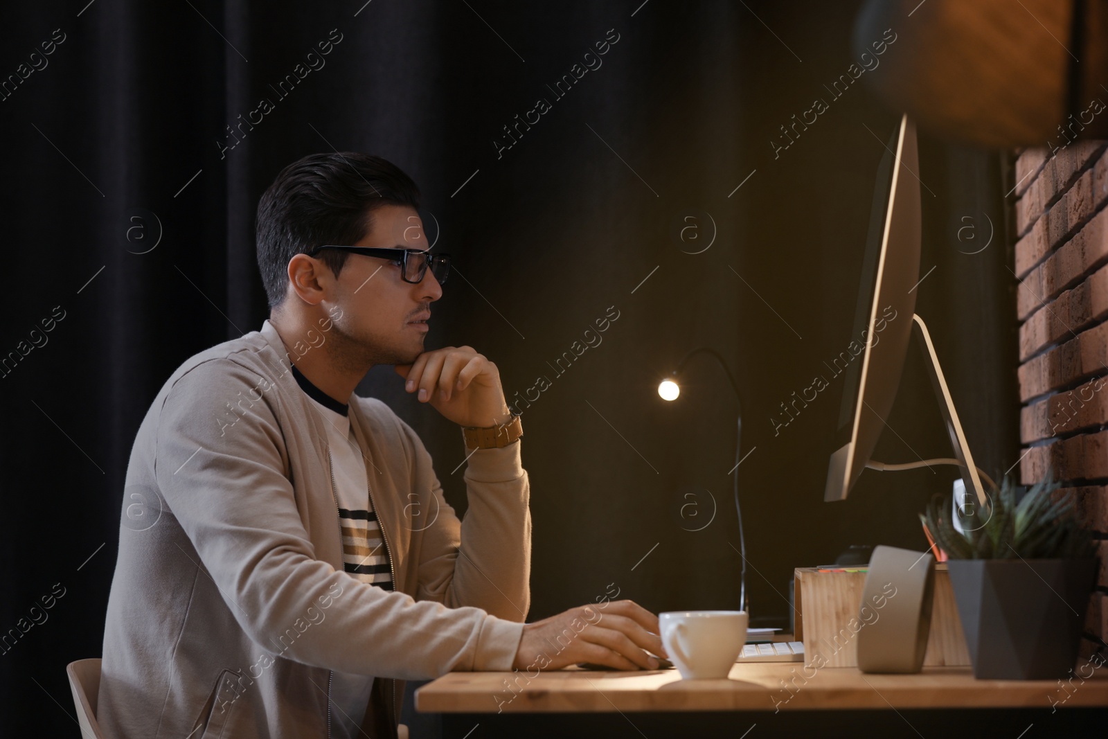 Photo of Journalist working with modern computer in office