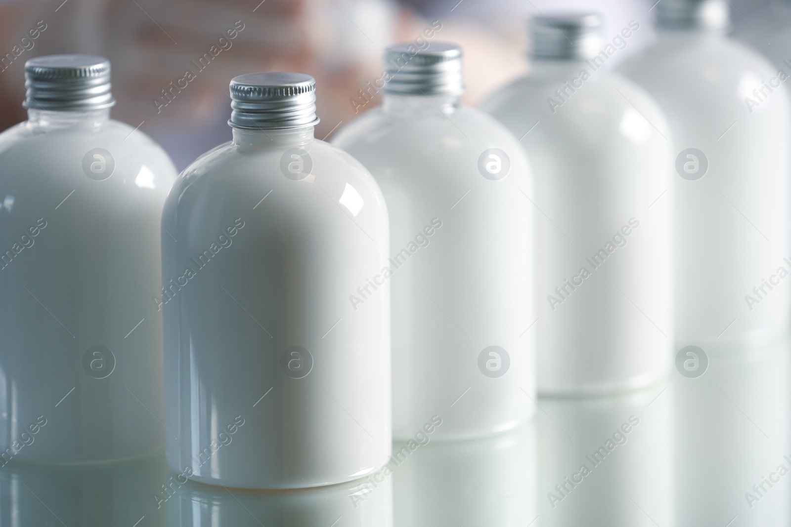 Photo of Many bottles with cosmetic product in laboratory