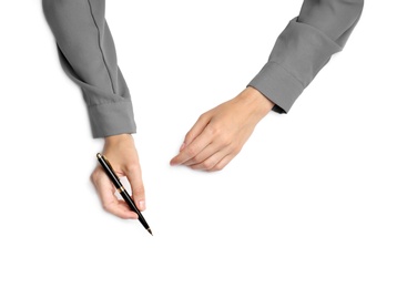 Photo of Woman with pen on white background, top view. Closeup of hands