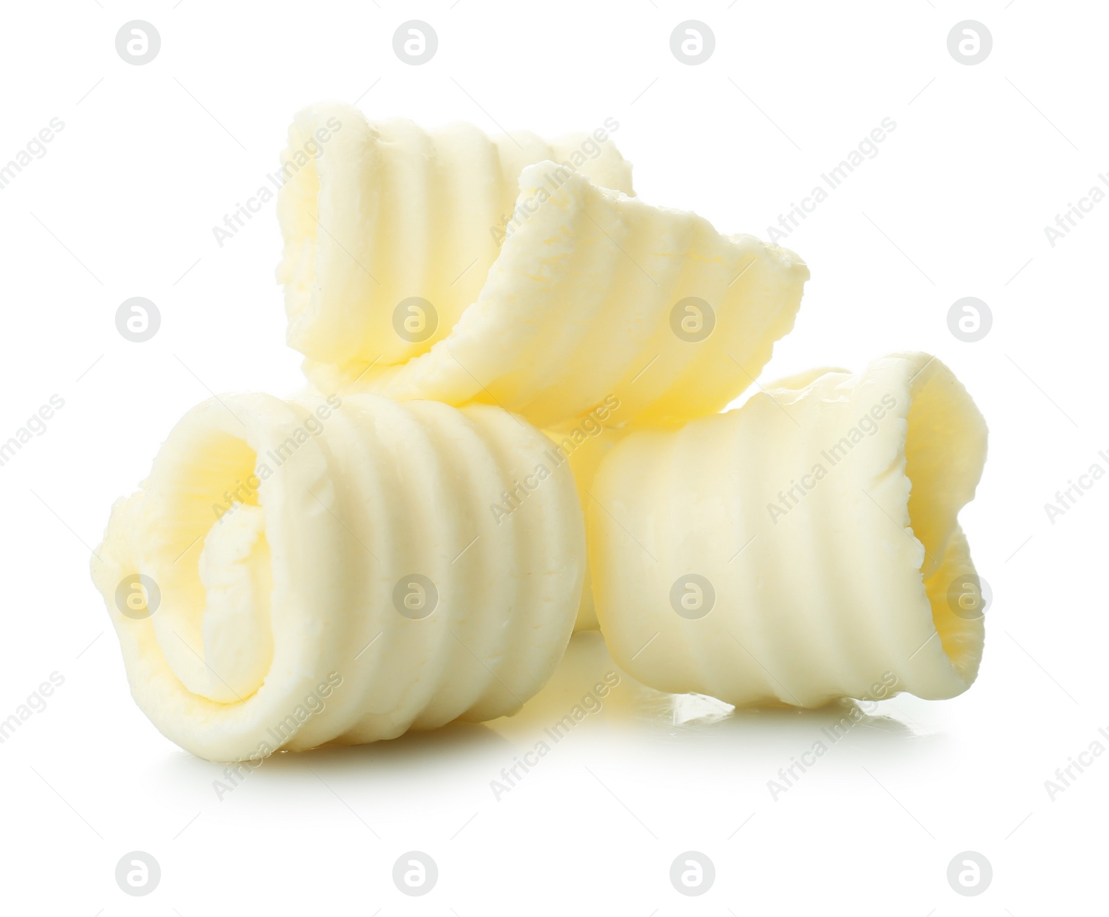 Photo of Tasty butter curls on white background