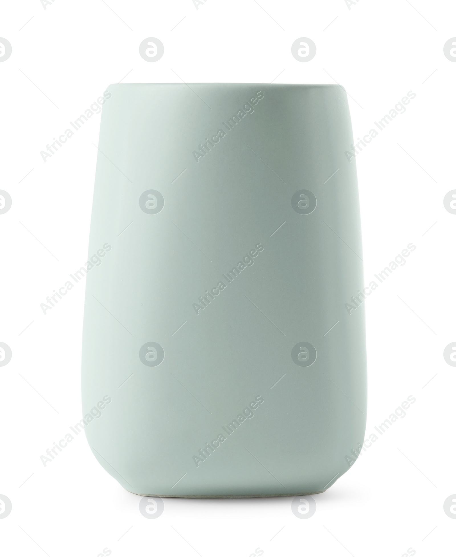 Photo of Bath accessory. Light green ceramic toothbrush holder isolated on white