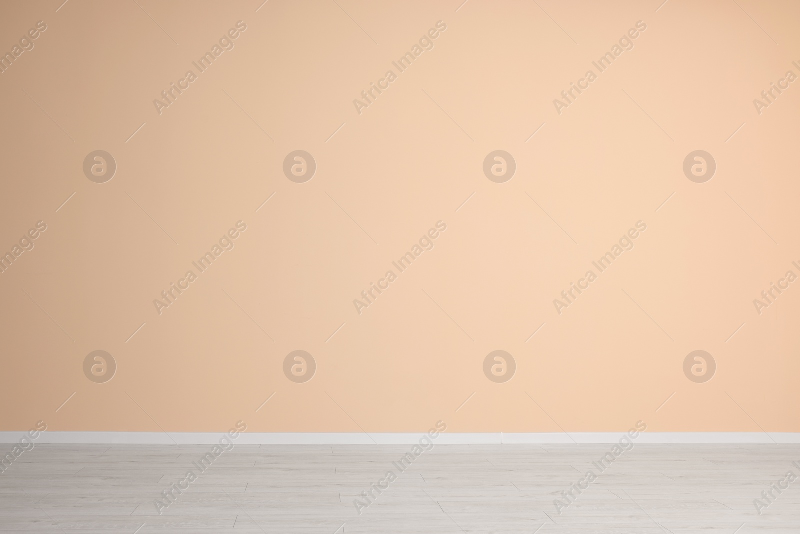 Photo of Empty room with beige wall and wooden floor