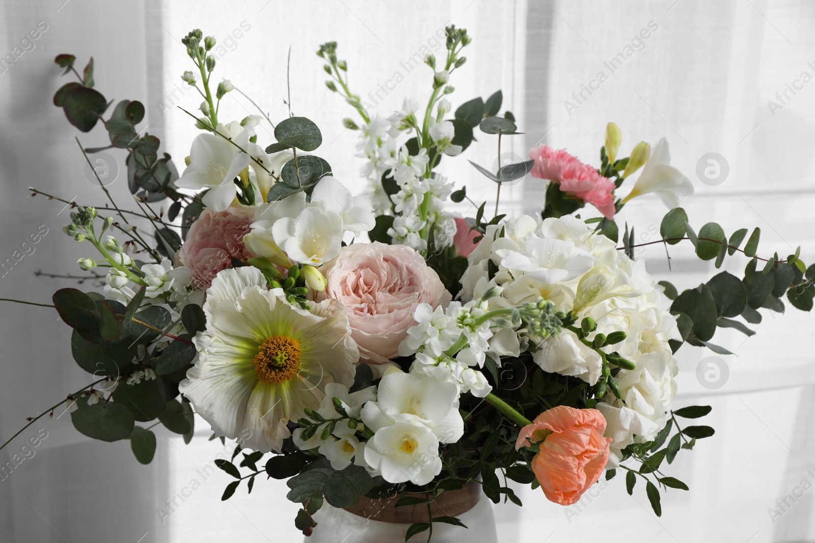 Photo of Bouquet of beautiful flowers on light background, closeup