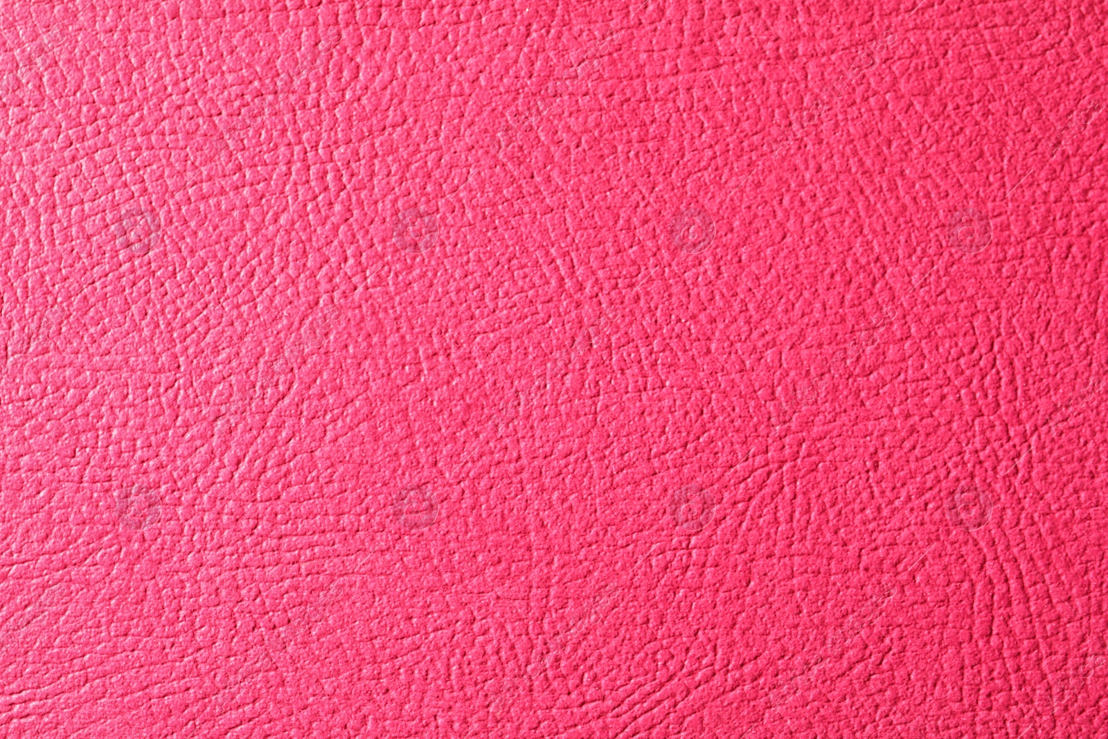 Photo of Texture of pink leather as background, closeup