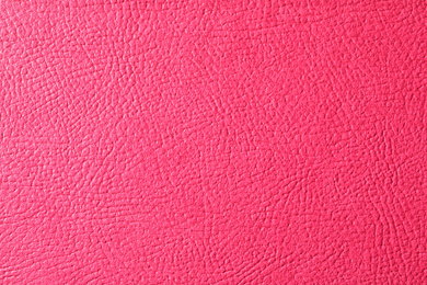 Texture of pink leather as background, closeup