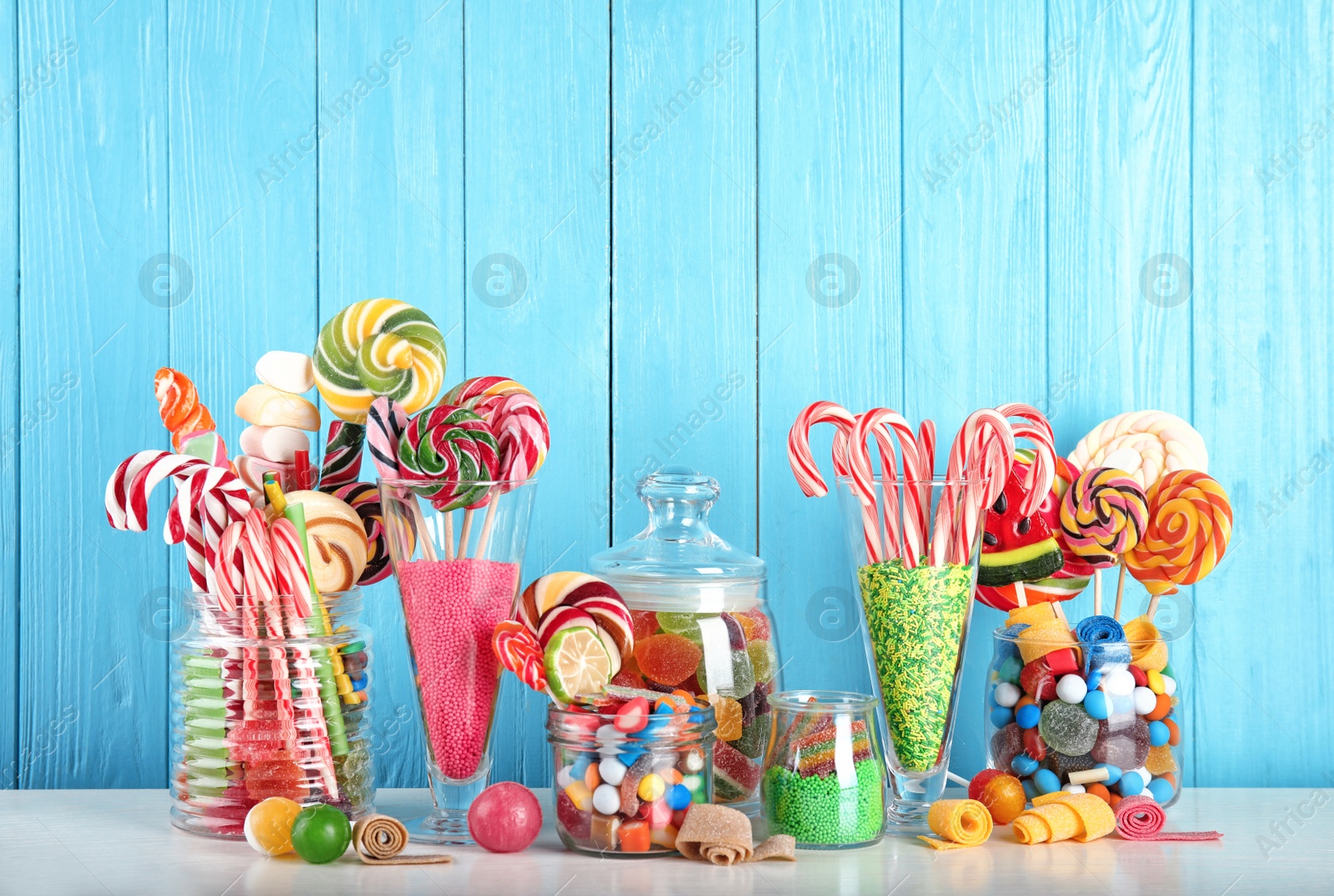 Photo of Composition with many different candies on table