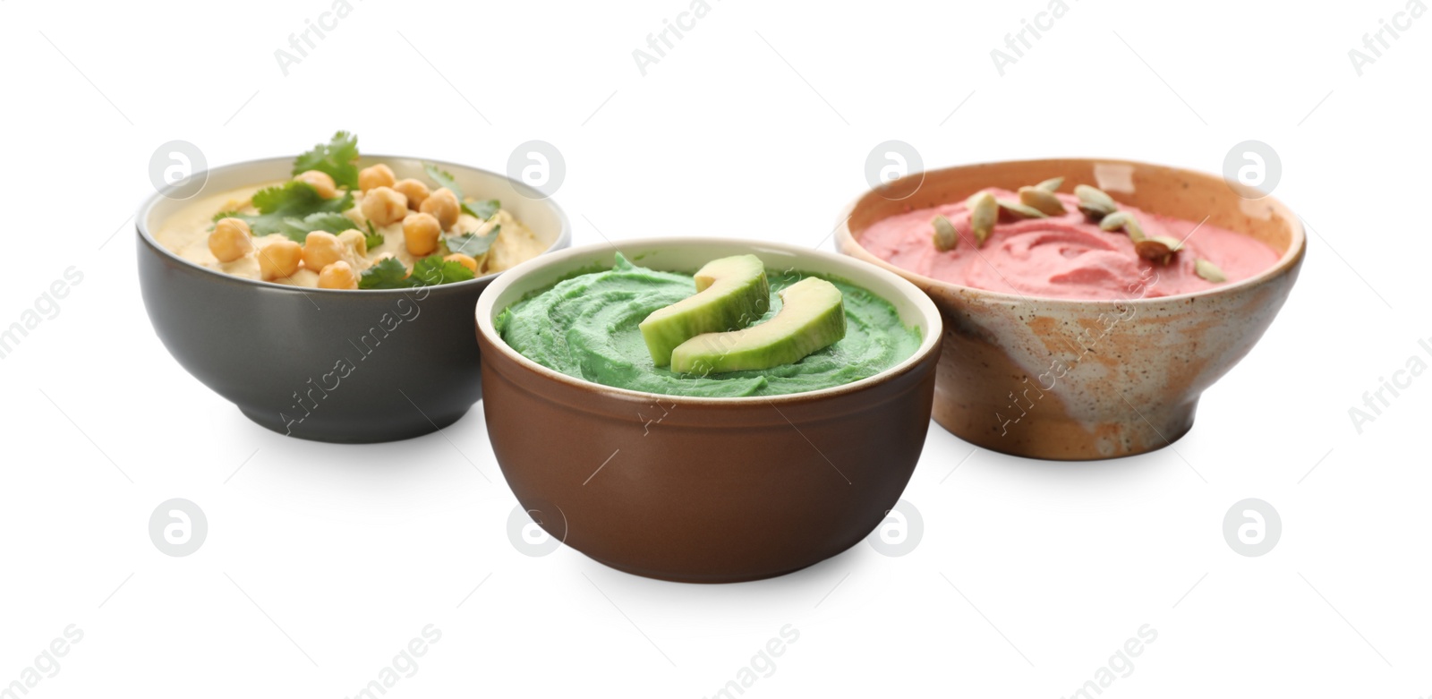 Photo of Different kinds of tasty hummus in bowls on white background