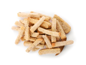 Heap of crispy rusks with seasoning on white background, top view