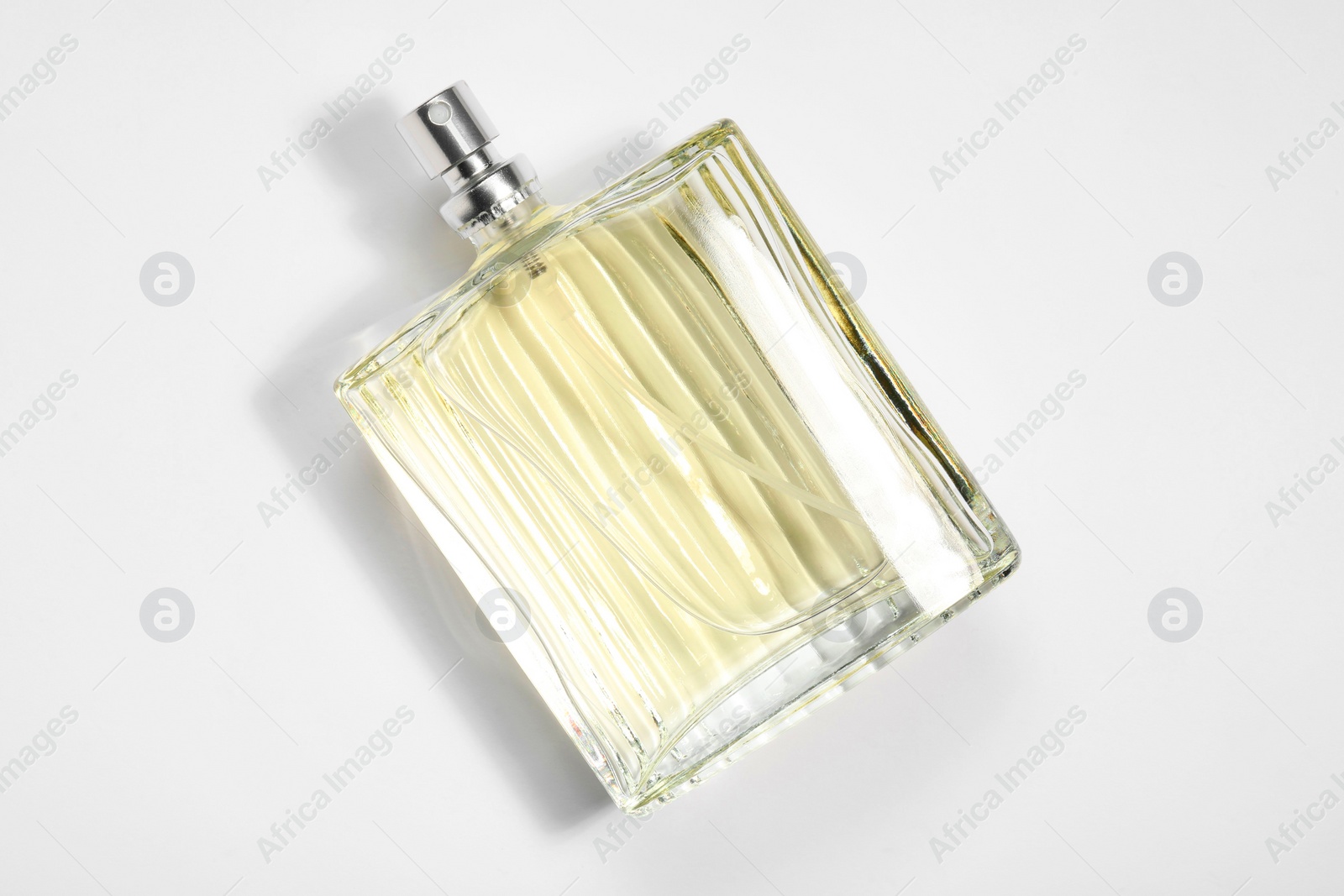 Photo of Luxury men`s perfume in bottle on white background, top view