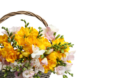 Beautiful blooming freesias in wicker basket on white background, closeup