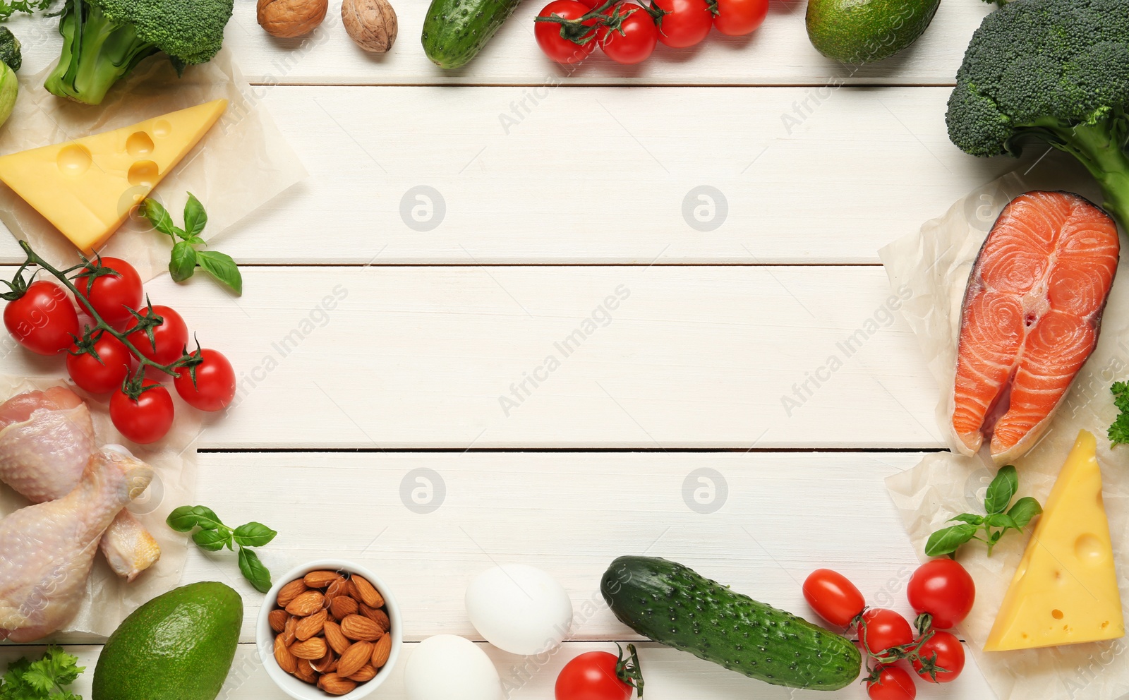 Photo of Frame of different fresh products on white wooden table, flat lay with space for text. Keto diet