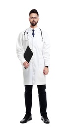 Photo of Young male doctor in uniform with clipboard isolated on white