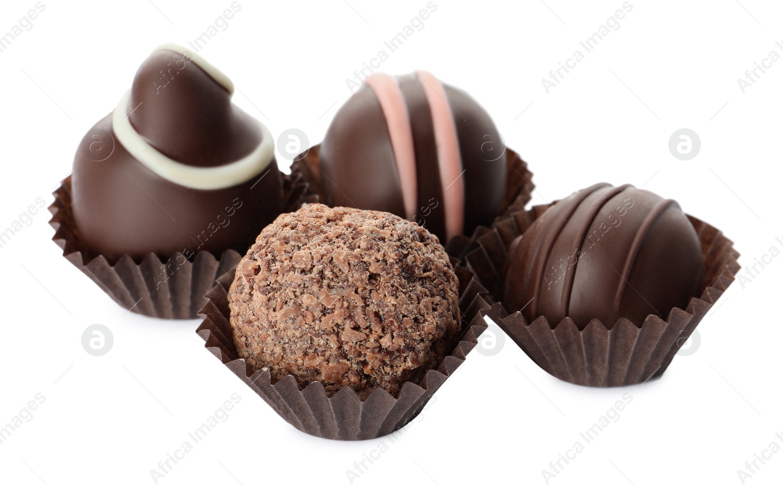 Photo of Many different delicious chocolate truffles on white background