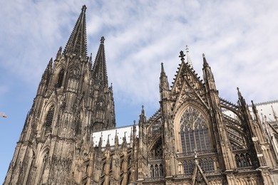 Photo of Cologne, Germany - August 28, 2022: Beautiful old gothic cathedral against blue sky