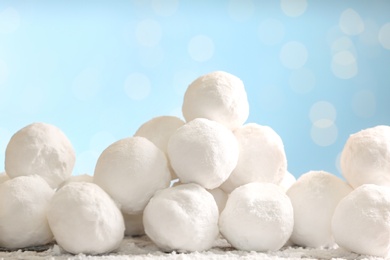 Round snowballs on table against blurred lights