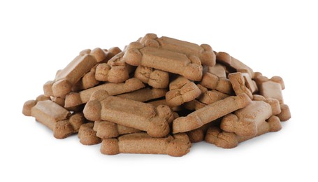 Pile of bone shaped dog cookies on white background