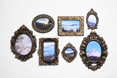 Photo of Vintage frames with photos of beautiful landscapes hanging on white wall