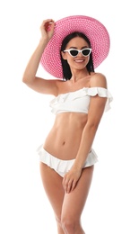 Photo of Beautiful young woman in stylish bikini with hat on white background