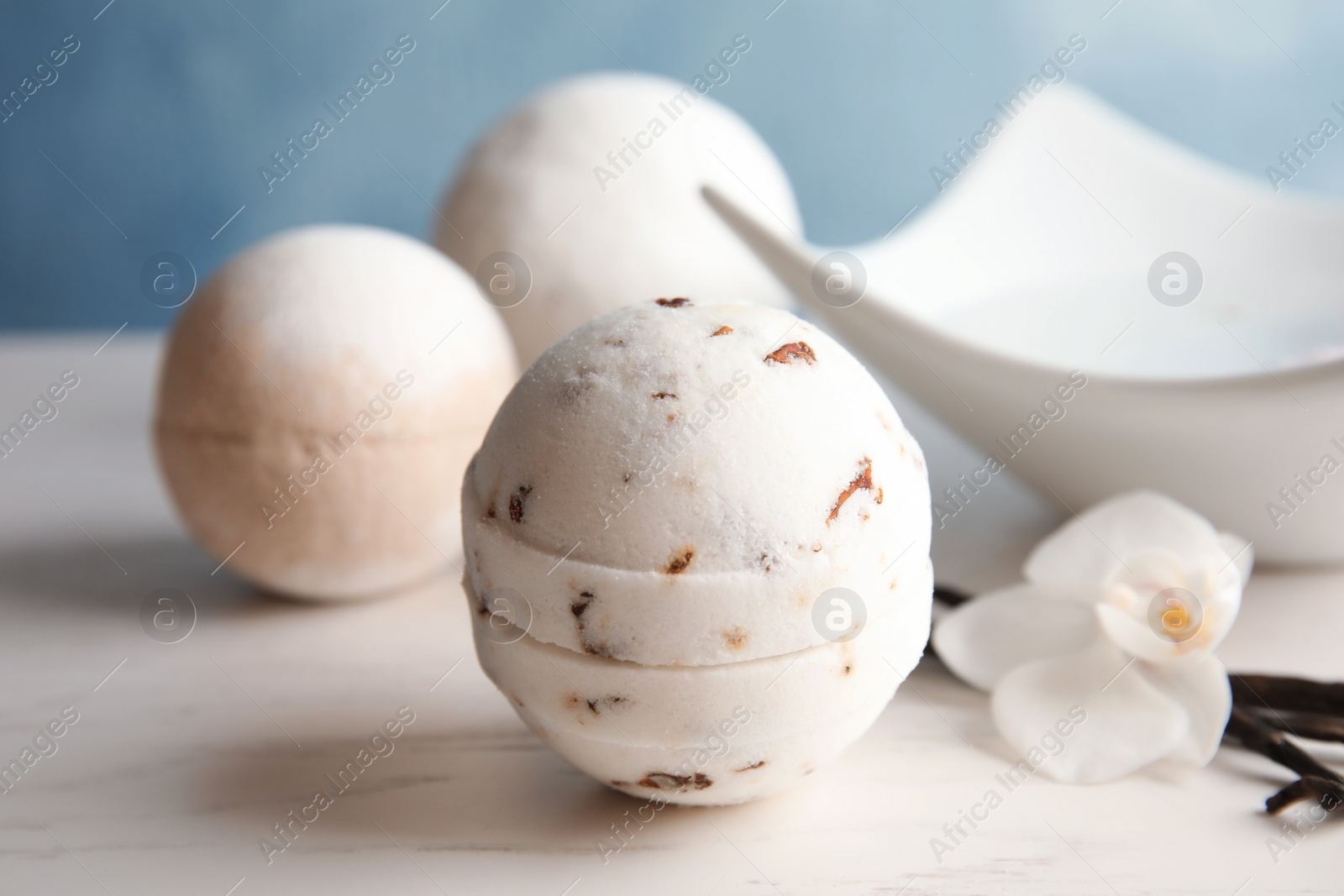 Photo of Bath bomb on white table. Spa product