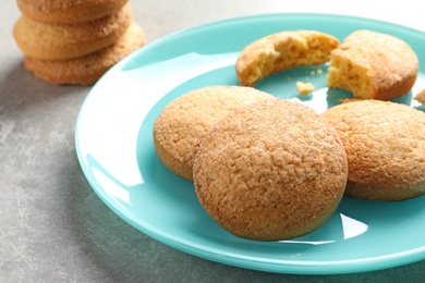 Plate with Danish butter cookies on table, closeup. Space for text