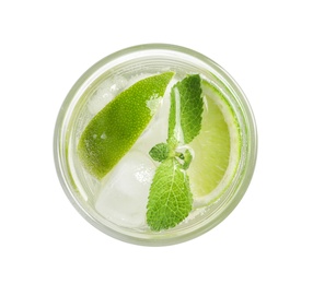 Refreshing beverage with mint and lime in glass on white background, top view