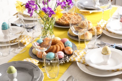 Photo of Festive Easter table setting with traditional meal