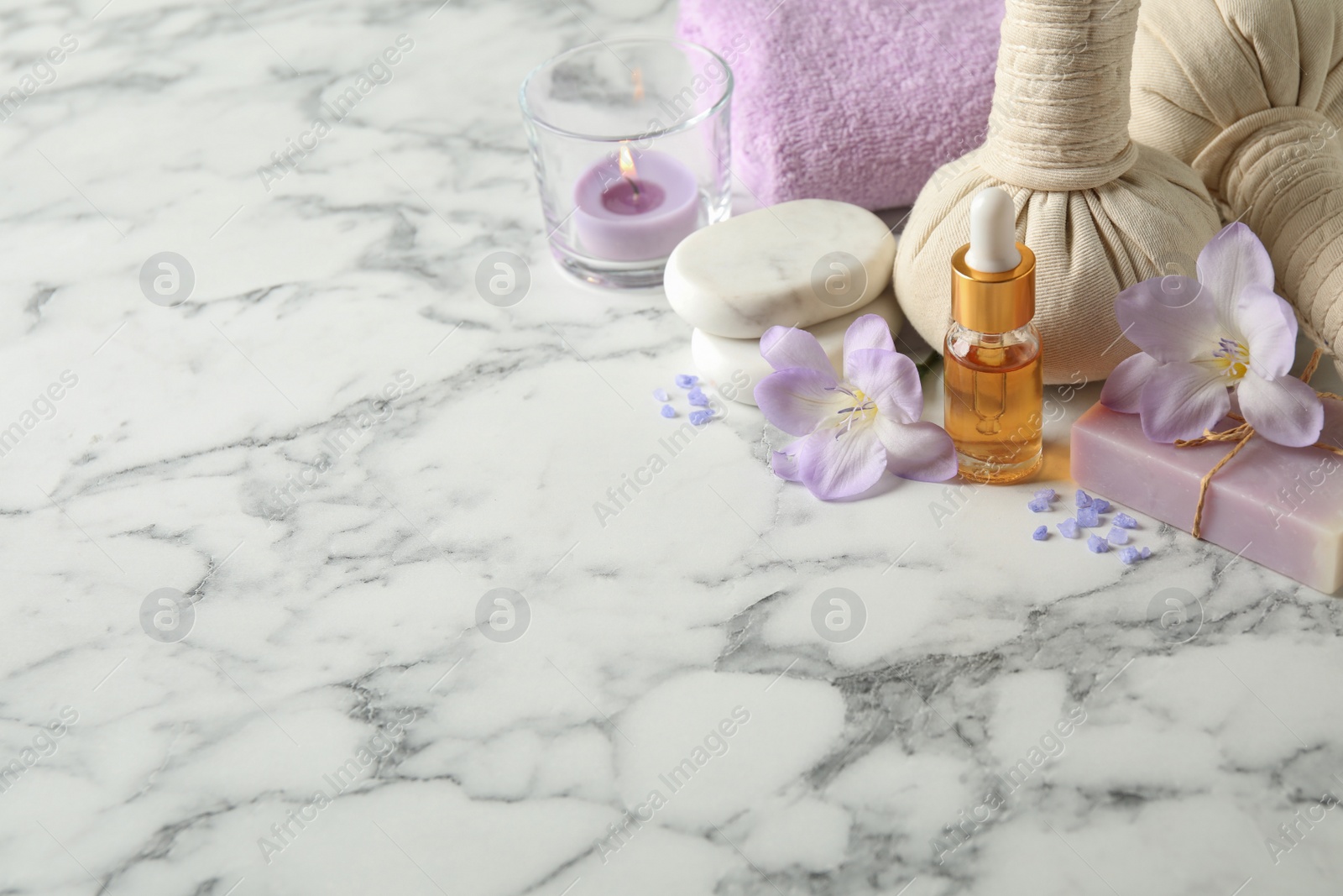 Photo of Spa composition with skin care products on white marble table. Space for text