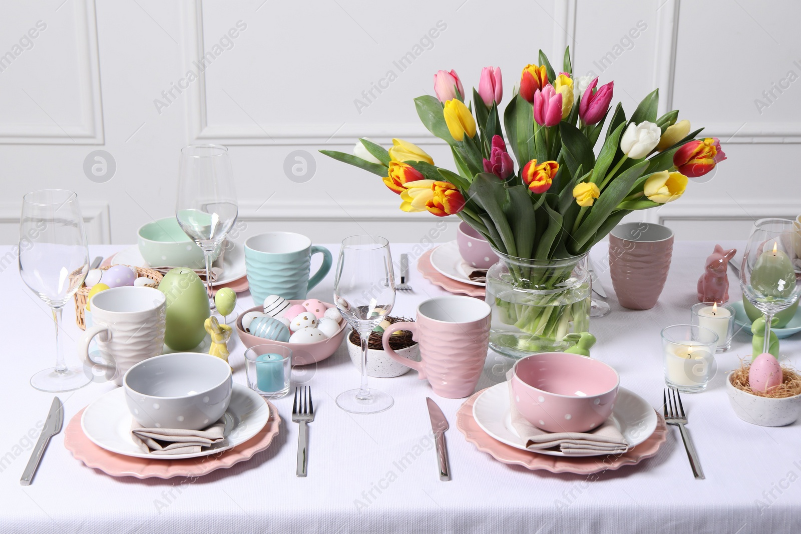 Photo of Festive table setting with beautiful flowers. Easter celebration