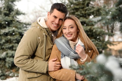 Photo of Beautiful happy couple outdoors on winter day