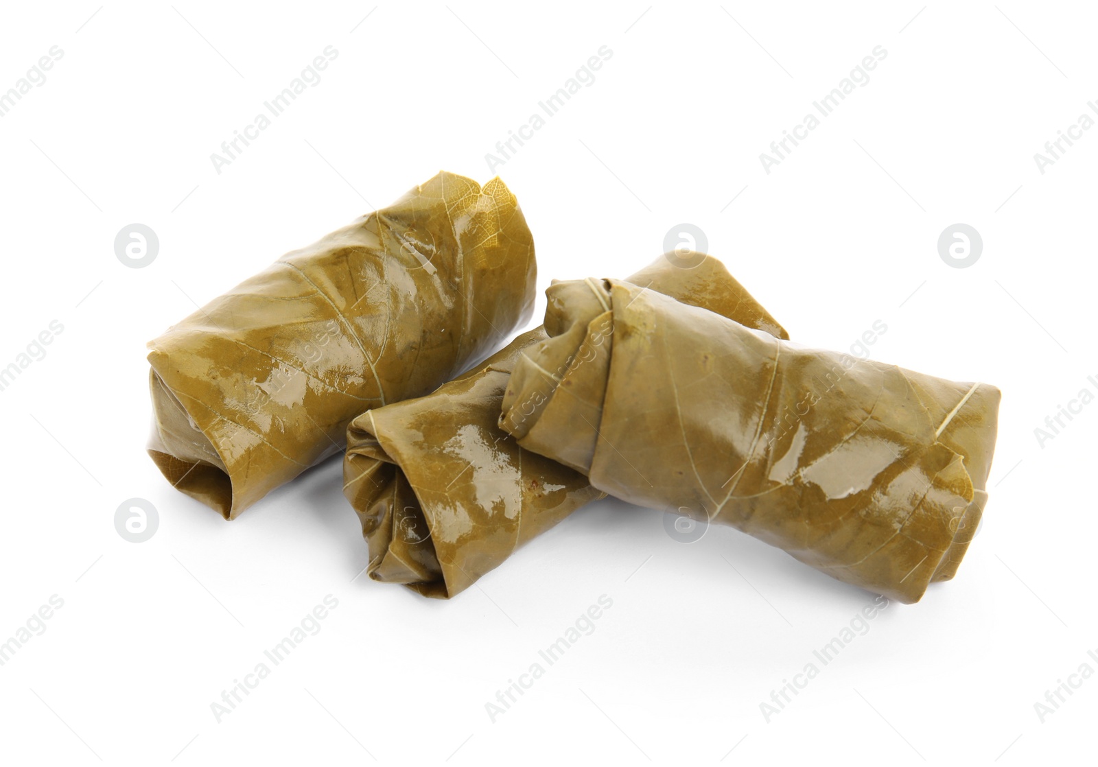 Photo of Delicious stuffed grape leaves on white background