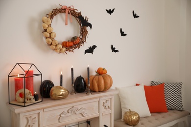 Photo of Fireplace and Halloween decor in room. Idea for festive interior