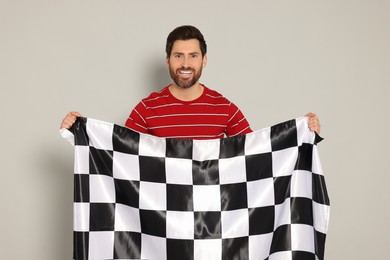 Photo of Man with checkered flag on white background