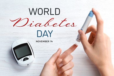 Image of World Diabetes Day. Woman using lancet pen at white wooden table, closeup