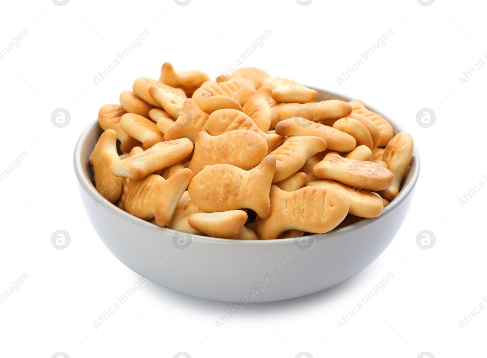 Photo of Delicious goldfish crackers in bowl isolated on white