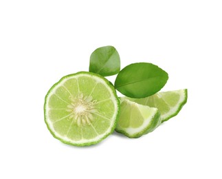 Cut ripe bergamot fruit and green leaves on white background