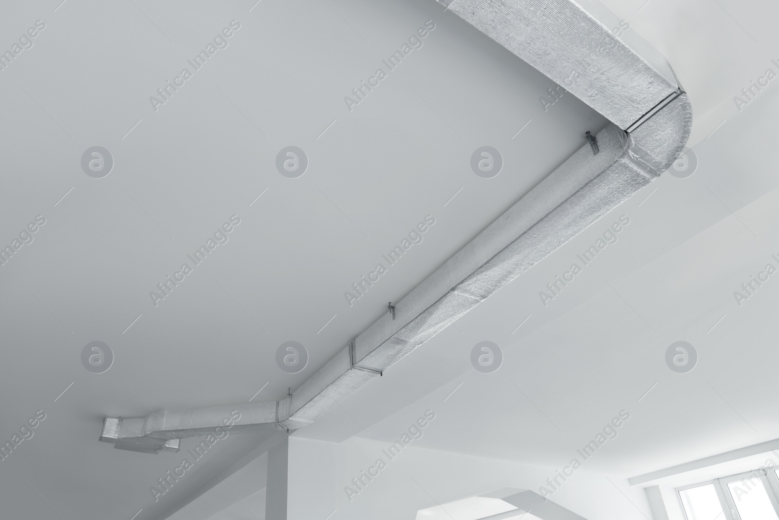 Photo of Ceiling with ventilation system indoors, bottom view