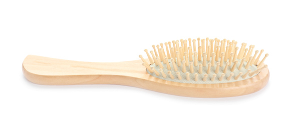 New wooden hair brush isolated on white