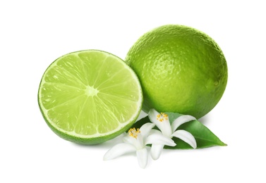 Ripe limes and flowers on white background. Citrus fruit