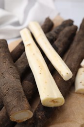 Raw salsify roots on table, closeup view