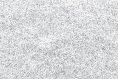 Image of White abrasive cleaning sponge as background, closeup