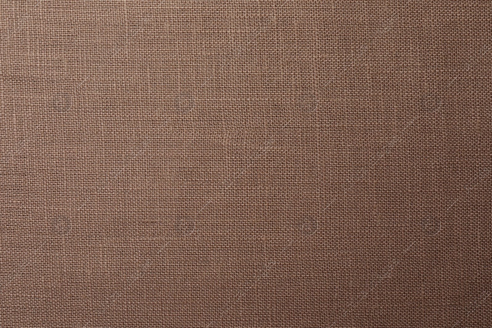 Photo of Texture of brown fabric as background, top view