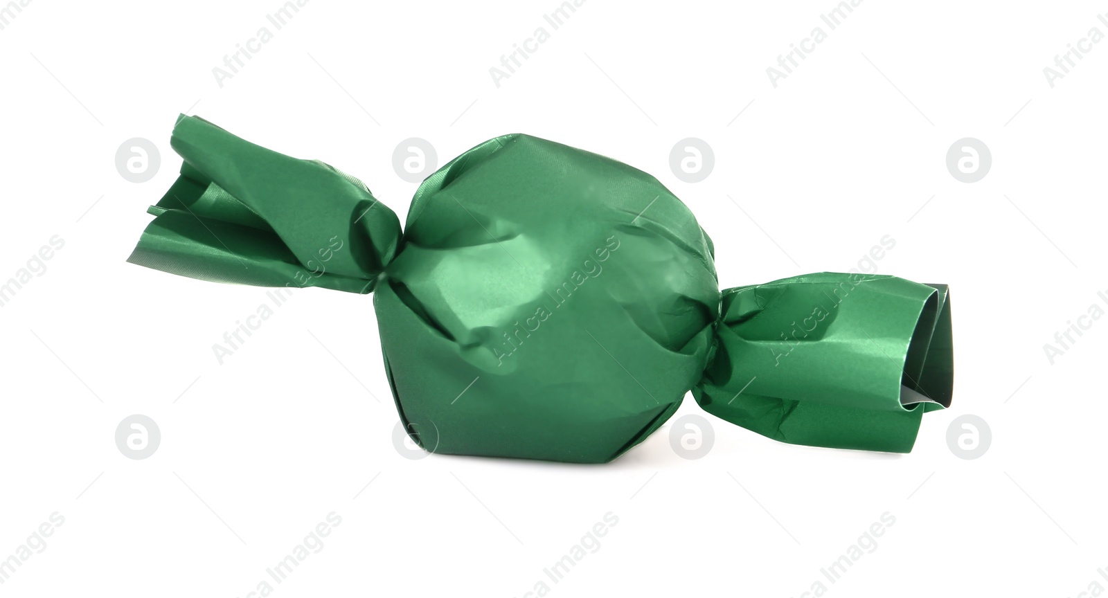 Photo of Delicious candy in dark green wrapper isolated on white
