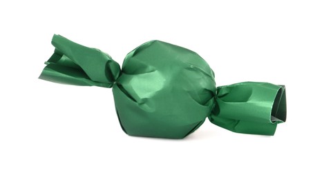 Photo of Delicious candy in dark green wrapper isolated on white
