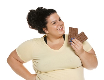 Happy overweight woman with chocolate on white background
