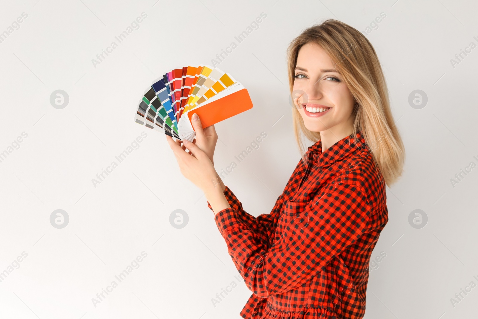 Photo of Young woman with color palette on white background