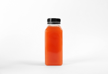 Photo of Bottle with delicious fresh juice on white background