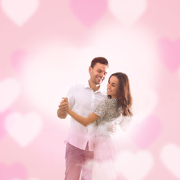Image of Lovely young couple dancing together on pink background. Valentine's day